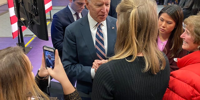 Democratic presidential candidate Joe Biden speaks with voters in Waukee, Iowa on Jan. 30, 2020