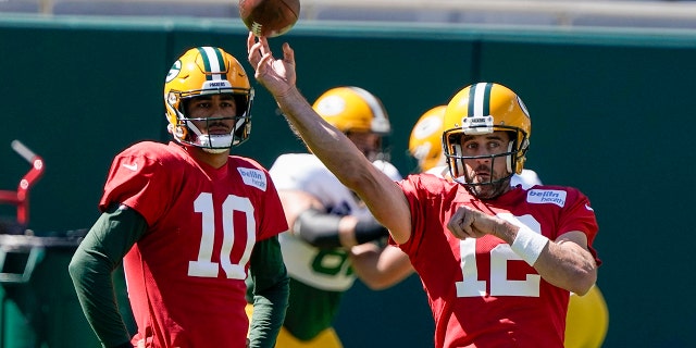 Green Bay Packers' Jordan Love watches Aaron Rodgers throw during NFL football practice Friday, Sept. 4, 2020, in Green Bay, Wis. (AP Photo/Morry Gash)
