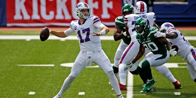 Buffalo Bills quarterback Josh Allen (17) throws a pass during the first half of an NFL football game against the New York Jets in Orchard Park, N.Y., Sunday, Sept. 13, 2020. (AP Photo/John Munson)