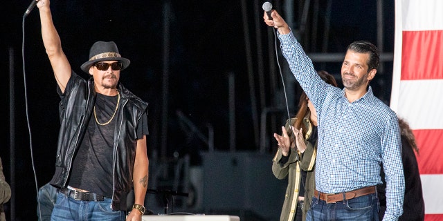 HARRISON, MICHIGAN - SEPTEMBER 14: Kid Rock (L) and Donald Trump Jr. speak onstage during the Trump 2020 rally on September 14, 2020 in Harrison, Michigan.