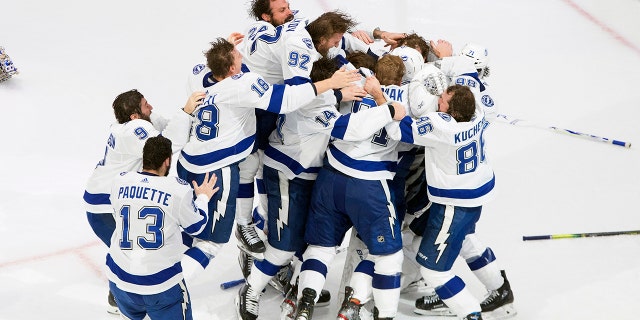 Tampa Bay Lightning players celebrate after defeating the Dallas Stars to win the Stanley Cup in Edmonton, Alberta, on Monday, Sept. 28, 2020. (AP)