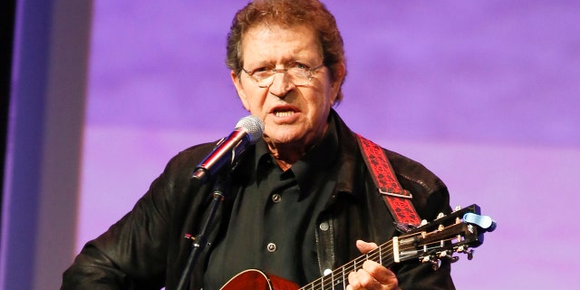 FILE - Musician Mac Davis performs at the Texas Film Awards in Austin, Texas on March 6, 2014. Davis, a country star and Elvis songwriter, died on Tuesday, Sept. 29, 2020 after heart surgery. He was 78. Davis started his career writing hits for Presley, including “A Little Less Conversation” and “In the Ghetto.” The Lubbock, Texas-native had a varied career over the years as a singer, actor and TV host and was inducted into the Songwriters Hall of Fame in 2006. He was named ACM entertainer of the year in 1974 after the success of songs like “Baby Don't Get Hooked on Me.” 