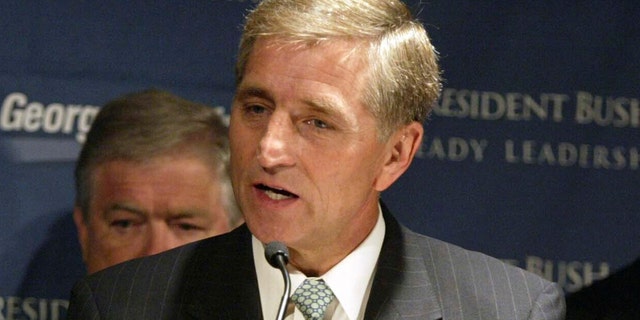 FILE - In this July 17, 2004, file photo, former GOP National Campaign Chairman Marc Racicot speaks at a news conference for a Bush-Cheney campaign event in Seattle. The former Montana governor and Republican National Committee chair said on Tuesday, Sept. 29, 2020, he will vote for Democrat Joe Biden in the November election, citing character flaws in President Donald Trump. (AP Photo/Jim Bryant, File)