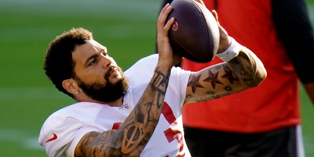 Tampa Bay Buccaneers wide receiver Mike Evans (13) makes a catch during an NFL football training camp practice Friday, Aug. 28, 2020, in Tampa, Fla. (AP Photo/Chris O'Meara)