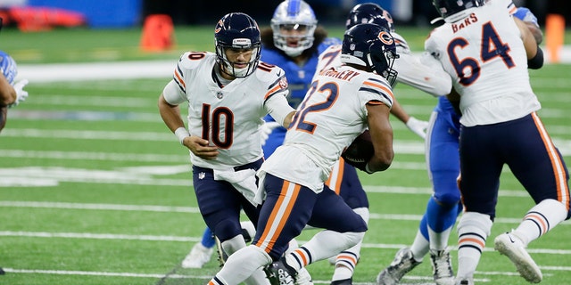 Chicago Bears quarterback Mitchell Trubisky (10) hands off to running back David Montgomery (32) in the second half of an NFL football game in Detroit, Sunday, Sept. 13, 2020. (AP Photo/Duane Burleson)