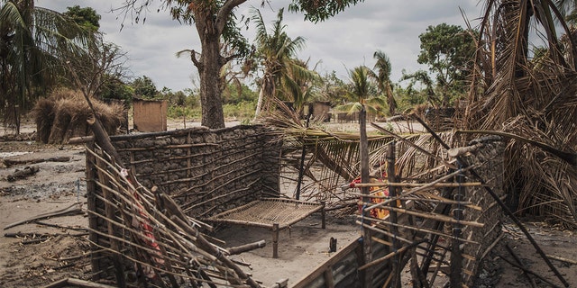 A bed is seen left in a destroyed house in the recently attacked village of Aldeia da Paz outside Macomia, on August 24, 2019. - On August 1st, the inhabitants of Aldeia da Paz joined the long list of victims of a faceless Islamist group that has been sowing death and terror for nearly two years in the north of the country, which welcomes from August 4 the Pope. (Photo by MARCO LONGARI / AFP) (Photo by MARCO LONGARI/AFP via Getty Images)