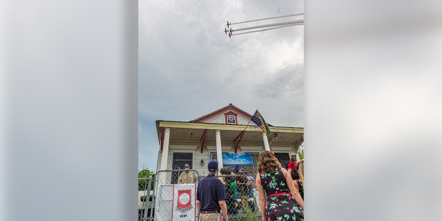 Military flyovers greeted Lawrence Brooks on his 111th birthday in New Orleans.
