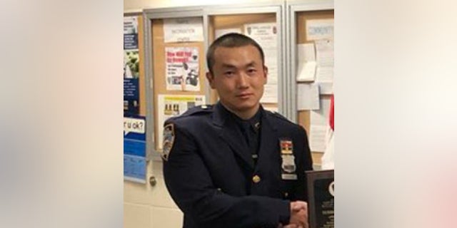 New York Police officer Baimadajie Angwang, 33, is accused of working for the Chinese government by spying on supporters of the free Tibet movement. A federal judge on Friday ordered him to home confinement pending $1 million bond.