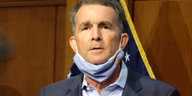 In this Sept. 1, 2020 file photo, Virginia Gov. Ralph Northam listens to a reporter's question during a press briefing inside the Patrick Henry Building in Richmond. (Bob Brown/Richmond Times-Dispatch via AP)