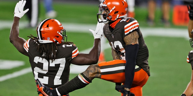 Cleveland Browns wide receiver Odell Beckham Jr., right, celebrates with running back Kareem Hunt after Beckham's touchdown during the first half of the team's NFL football game against the Cincinnati Bengals, Thursday, Sept. 17, 2020, in Cleveland. (AP Photo/Ron Schwane)