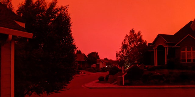 This photo taken from the home of Russ Casler in Salem, Ore., shows the smoke-darkened sky well before sunset, around 5 p.m., Tuesday, Sept. 8, 2020.