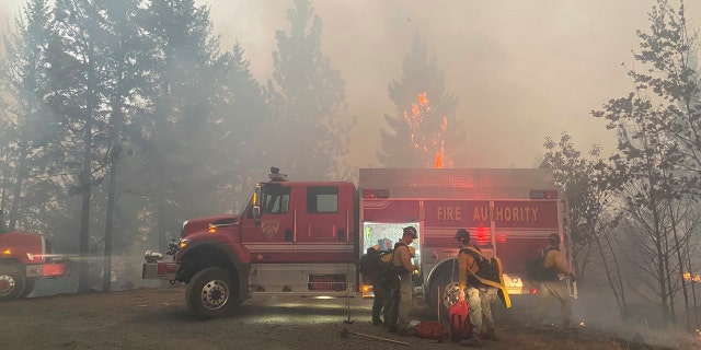 This photo provided by the Unified Fire Authority shows Utah fire crews prepare to fight wildfires near Butte Falls in southern Oregon on Saturday, Sept. 12, 2020.