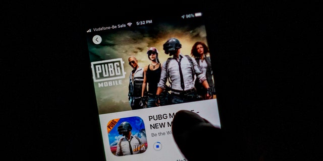 A man looks at the "PUBG Mobile" game, owned by Chinese internet giant Tencent, in the App Store on an Apple iPhone in New Delhi on Sept. 2, 2020. (Jewel SAMAD / AFP) (Photo by JEWEL SAMAD/AFP via Getty Images)