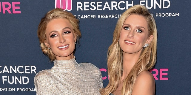 Nicky Hilton (right) called her sister Paris Hilton (left) 'greedy' while suggesting she reevaluate her work-life balance and take a vacation. (Photo by Axelle/Bauer-Griffin/FilmMagic)