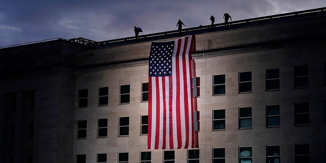 A large American flag is unfurled at the Pentagon (AP Photo/J. Scott Applewhite)