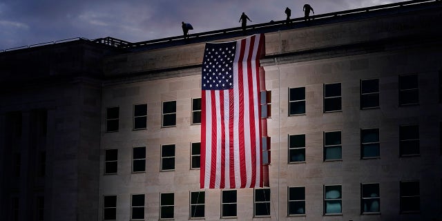 A large American flag is unfurled at the Pentagon (AP Photo/J. Scott Applewhite)