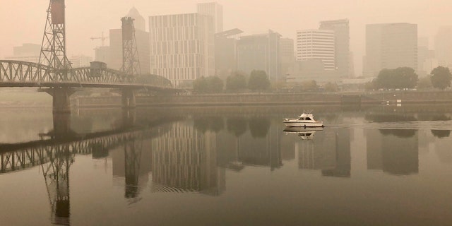 A view of downtown Portland from the East Bank Esplanade on Monday, Sept. 14, 2020. The entire Portland metropolitan region remains under a thick blanket of smog from wildfires that are burning around the state, and residents are being advised to remain indoors due to hazardous air quality.