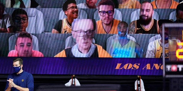 A video board showing virtual fans includes cutouts of Supreme Court Justice Ruth Bader Ginsburg, center left, and the late Kobe Bryant, center right, during the first half an NBA conference final playoff basketball game between the Los Angeles Lakers and Denver Nuggets on Friday, Sept. 18, 2020, in Lake Buena Vista, Fla. (AP Photo/Mark J. Terrill)