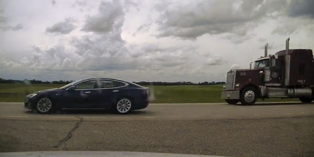 Photo of Tesla Model S with reclined seats.