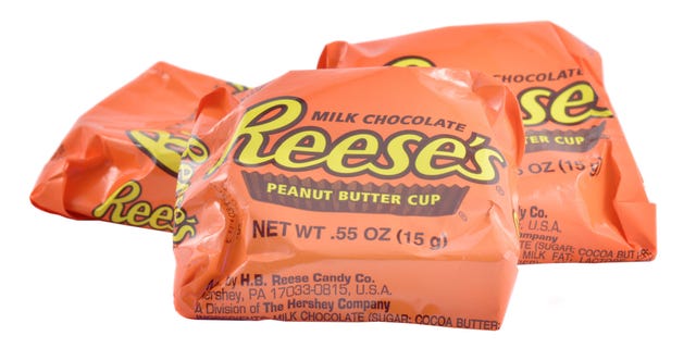 Reese's Peanut Butter Cups are chocolate-shelled candy cups that encase a peanut butter filling.