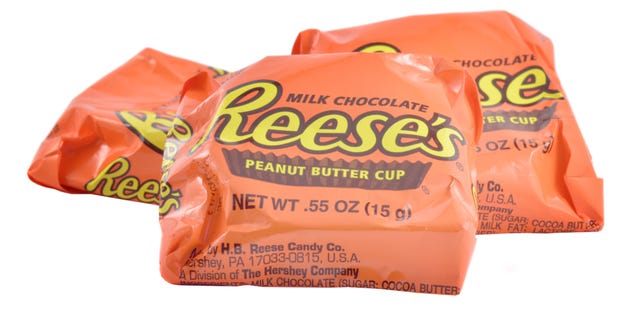 Reese's Peanut Butter Cups are chocolate-shelled candy cups that encase a peanut butter filling.