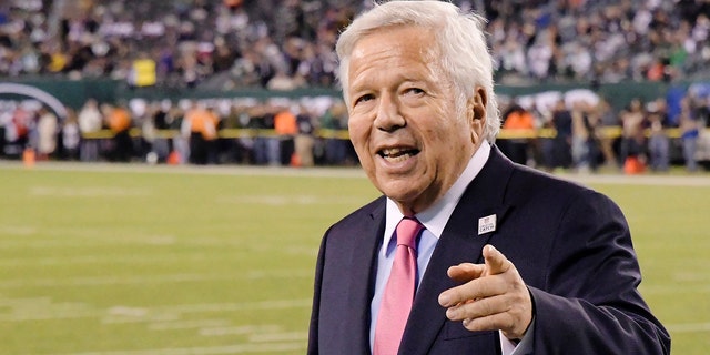 New England Patriots owner Robert Kraft points to fans as his team warms up before an NFL football game against the New York Jets in East Rutherford, N.J on Oct. 21, 2019. 
