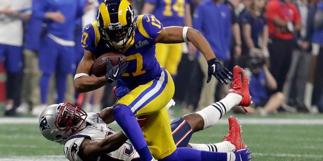 FILE - In this Feb. 3, 2019, file photo, Los Angeles Rams' Robert Woods (17) breaks a tackle by New England Patriots' Jonathan Jones (31) during the second half of the NFL Super Bowl 53 football game in Atlanta.