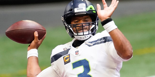 Seattle Seahawks quarterback Russell Wilson (3) warms up before the first half of an NFL football game against the Atlanta Falcons, Sunday, Sept. 13, 2020, in Atlanta. (AP Photo/John Bazemore)