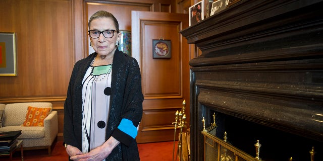 FILE - In this July 31, 2014, file photo, Associate Justice Ruth Bader Ginsburg is seen in her chambers in at the Supreme Court in Washington. (AP Photo/Cliff Owen, File)