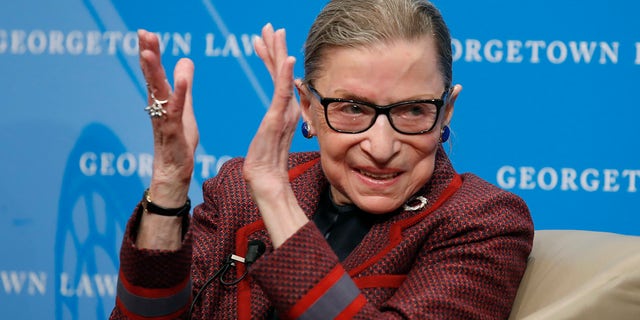 In this April 6, 2018, file photo, Supreme Court Justice Ruth Bader Ginsburg applauds after a performance in her honor after she spoke about her life and work during a discussion at Georgetown Law School in Washington. (AP Photo/Alex Brandon, File)