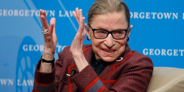 In this April 6, 2018, file photo, Supreme Court Justice Ruth Bader Ginsburg applauds after a performance in her honor after she spoke about her life and work during a discussion at Georgetown Law School in Washington. (AP Photo/Alex Brandon, File)