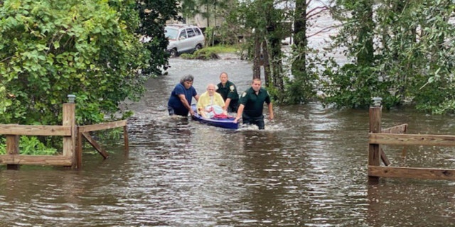 A man who was running out of oxygen was rescued from his flooded home after Hurricane Sally made landfall on Wednesday, Sept. 16, 2020.