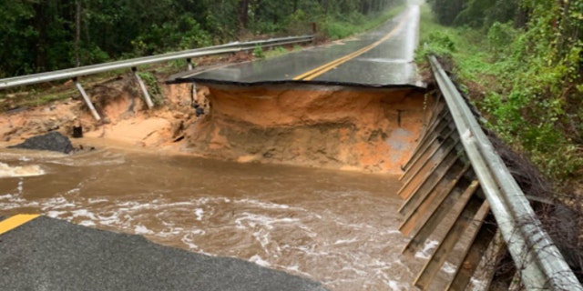 Roadways across Florida's Panhandle were washed out by heavy rain from Hurricane Sally.