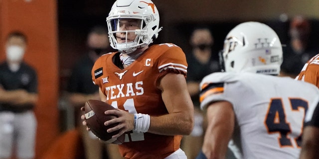 Texas' Sam Ehlinger (11) looks to pass against UTEP during the first half of an NCAA college football game in Austin, Texas, Saturday, Sept. 12, 2020. (AP Photo/Chuck Burton)