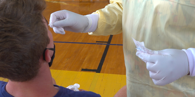 An Alabama State University student receiving a COVID-19 test.