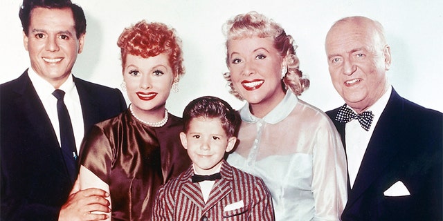 From left, Desi Arnaz (1917-1986), musician and actor; Lucille Ball (1911-1989), comedian and actress; Keith Thibodeaux, child actor; Vivian Vance (1909-1979), actress; and William Frawley (1887-1966), actor, in a group studio portrait issued for the US TV series "I Love Lucy," circa 1955.
