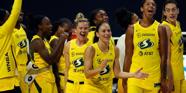 The Seattle Storm celebrate after the team defeated the Minnesota Lynx during Game 3 of a WNBA basketball semifinal round playoff series Sunday, Sept. 27, 2020, in Bradenton, Fla. The Storm move onto the WNBA finals. (Associated Press)