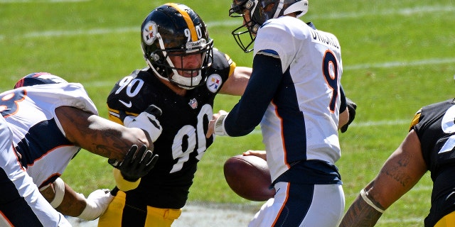 Pittsburgh Steelers outside linebacker T.J. Watt (90) sacks Denver Broncos quarterback Jeff Driskel (9) during the first half of an NFL football game in Pittsburgh, Sunday, Sept. 20, 2020. (AP Photo/Don Wright)