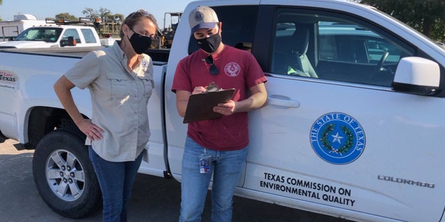 Investigators from the Texas Commission on Environmental Quality conduct water sampling in Lake Jackson, Texas on Sept. 26, 2020 after a brain-eating amoeba was detected in the city's water supply.