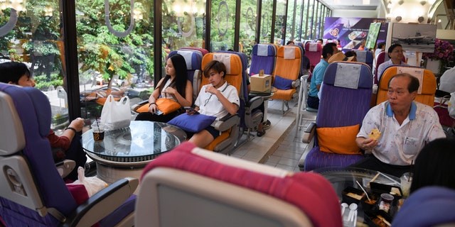 Diners eat at Thai Airways' pop-up restaurant inside the airline's Bangkok headquarters on Thursday.