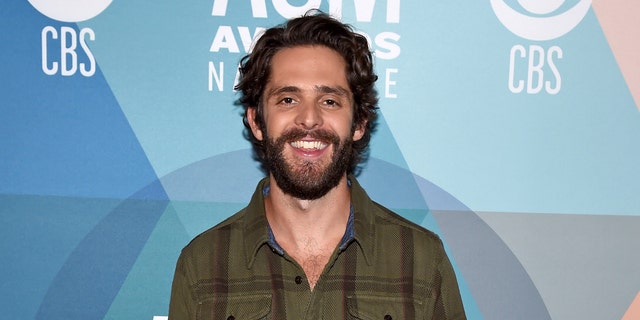 Thomas Rhett scored an early win for his 'Remember You Young' music video. He also tied for the night's biggest award, entertainer of the year, with Carrie Underwood. (Photo by John Shearer/ACMA2020/Getty Images for ACM)