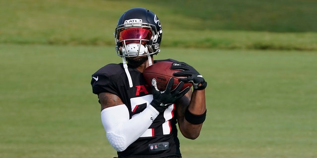 Atlanta Falcons running back Todd Gurley II (21) makes a catch during an NFL training camp football practice Thursday, Aug. 20, 2020, in Flowery Branch, Ga. (AP Photo/John Bazemore, Pool)