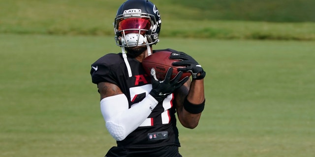 Atlanta Falcons running back Todd Gurley II (21) makes a catch during an NFL training camp football practice Thursday, Aug. 20, 2020, in Flowery Branch, Ga. (AP Photo/John Bazemore, Pool)