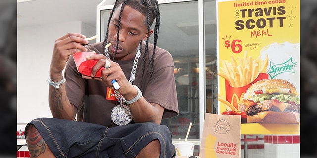 Travis Scott is seen enjoying a Travis Scott Meal at McDonald's.