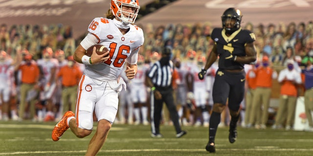 Clemson quarterback Trevor Lawrence scores against Wake Forest during the first half of an NCAA college football game Saturday, Sept. 12, 2020, in Winston-Salem, N.C. (Walt Unks/The Winston-Salem Journal via AP)