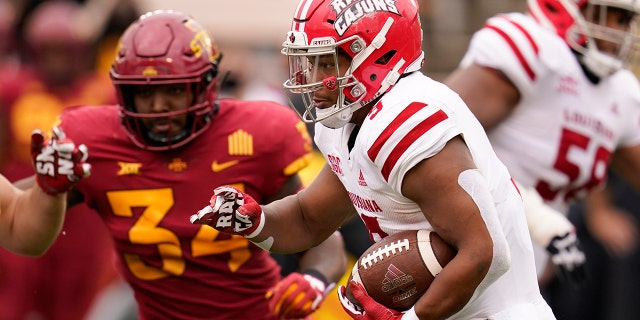 Louisiana-Lafayette running back Trey Ragas runs from Iowa State linebacker O'Rien Vance (34) during the second half of an NCAA college football game, Saturday, Sept. 12, 2020, in Ames, Iowa. Louisiana-Lafayette won 31-14. (AP Photo/Charlie Neibergall)