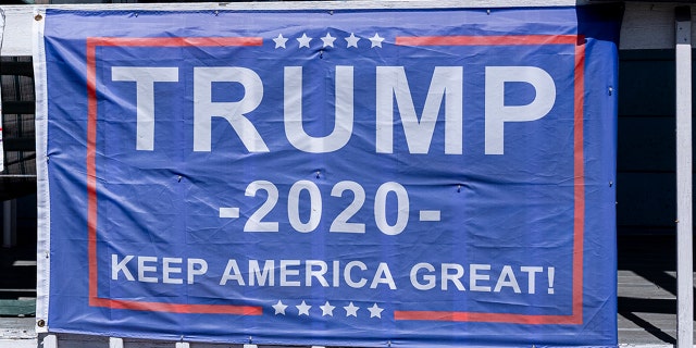 A "Trump 2020" campaign flag attached to a railing Sept. 11, in Scranton, Pa. (Photo by Robert Nickelsberg/Getty Images)