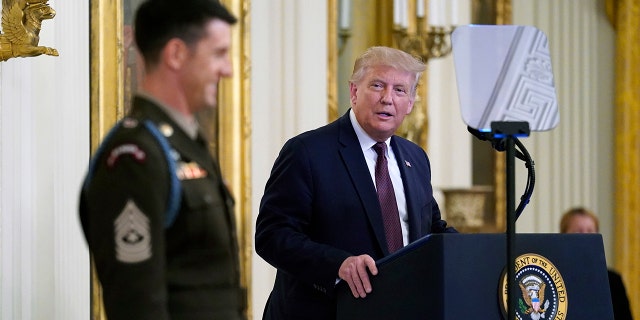 President Donald Trump awards the Medal of Honor to Army Sgt. Maj. Thomas P. Payne in the East Room of the White House on Friday, Sept. 11, 2020, in Washington. (AP Photo/Andrew Harnik)