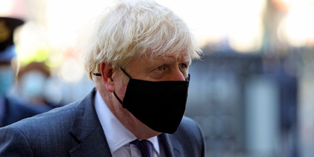 Britain's Prime Minister Boris Johnson arrives for a service to mark the 80th anniversary of the Battle of Britain at Westminster Abbey, London, Sunday, Sept. 20, 2020.