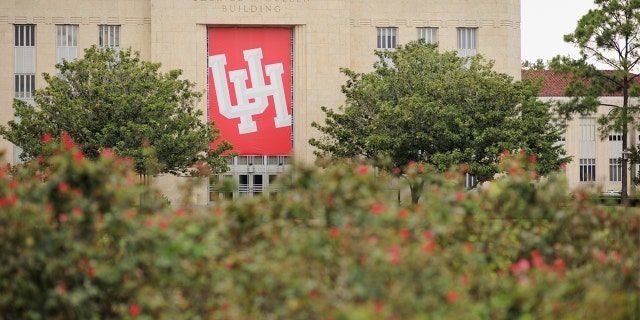 Sign for the University of Houston hanging on Ezekiel W Cullen Building.  